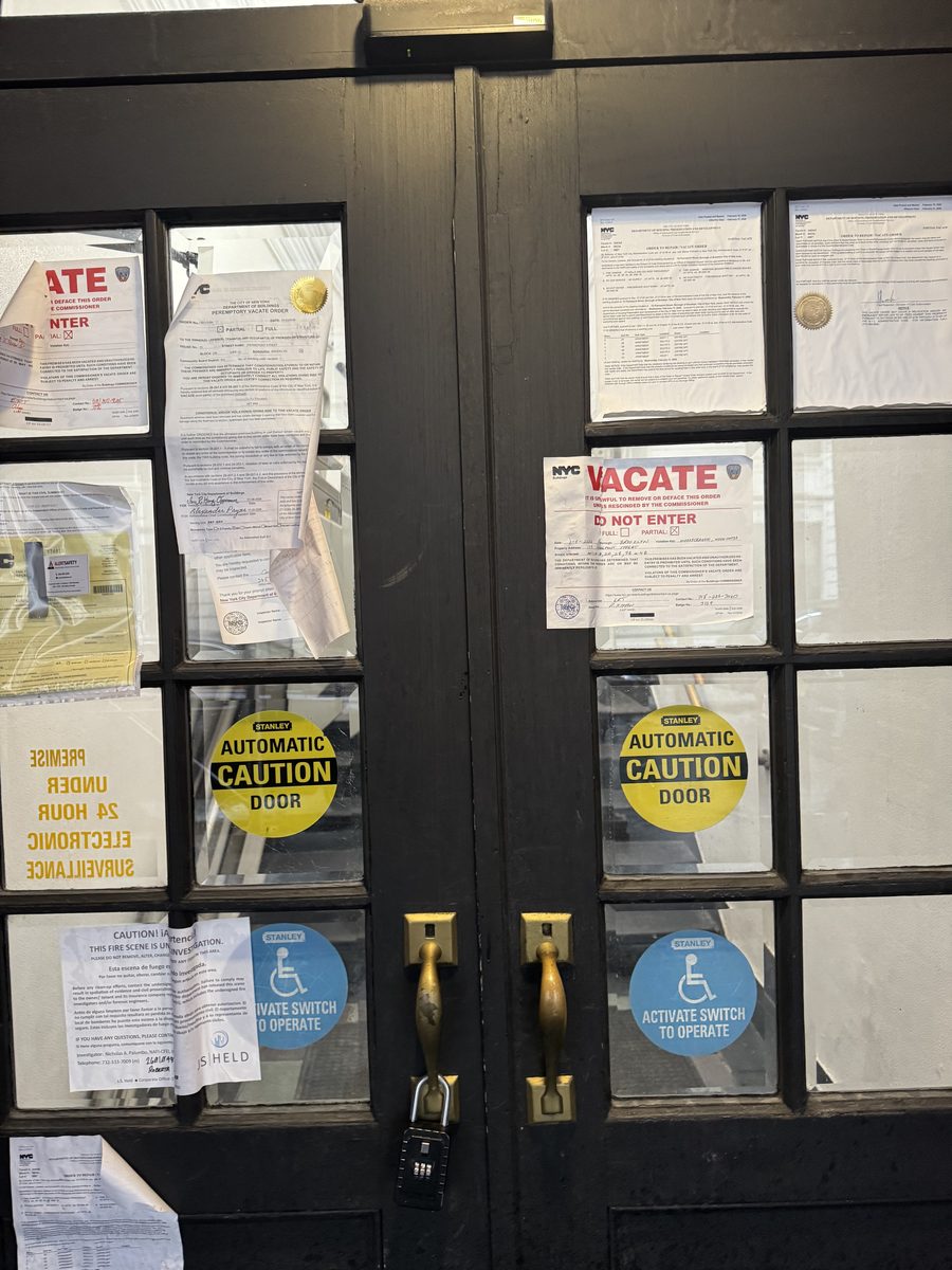 Vacate orders posted on the front door of 75 Pierrepont Street